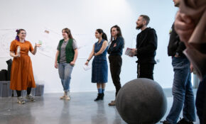 Students and exhibition curators during a tour of the Missing Spaces exhibition at Emily Carr University.