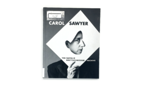 Book cover with woman holding paper up, with a cut-out allowing the profile of her face to show.