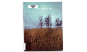 Book cover with atmospheric photograph of a field of grass, with sparse trees and a cloudy sky.