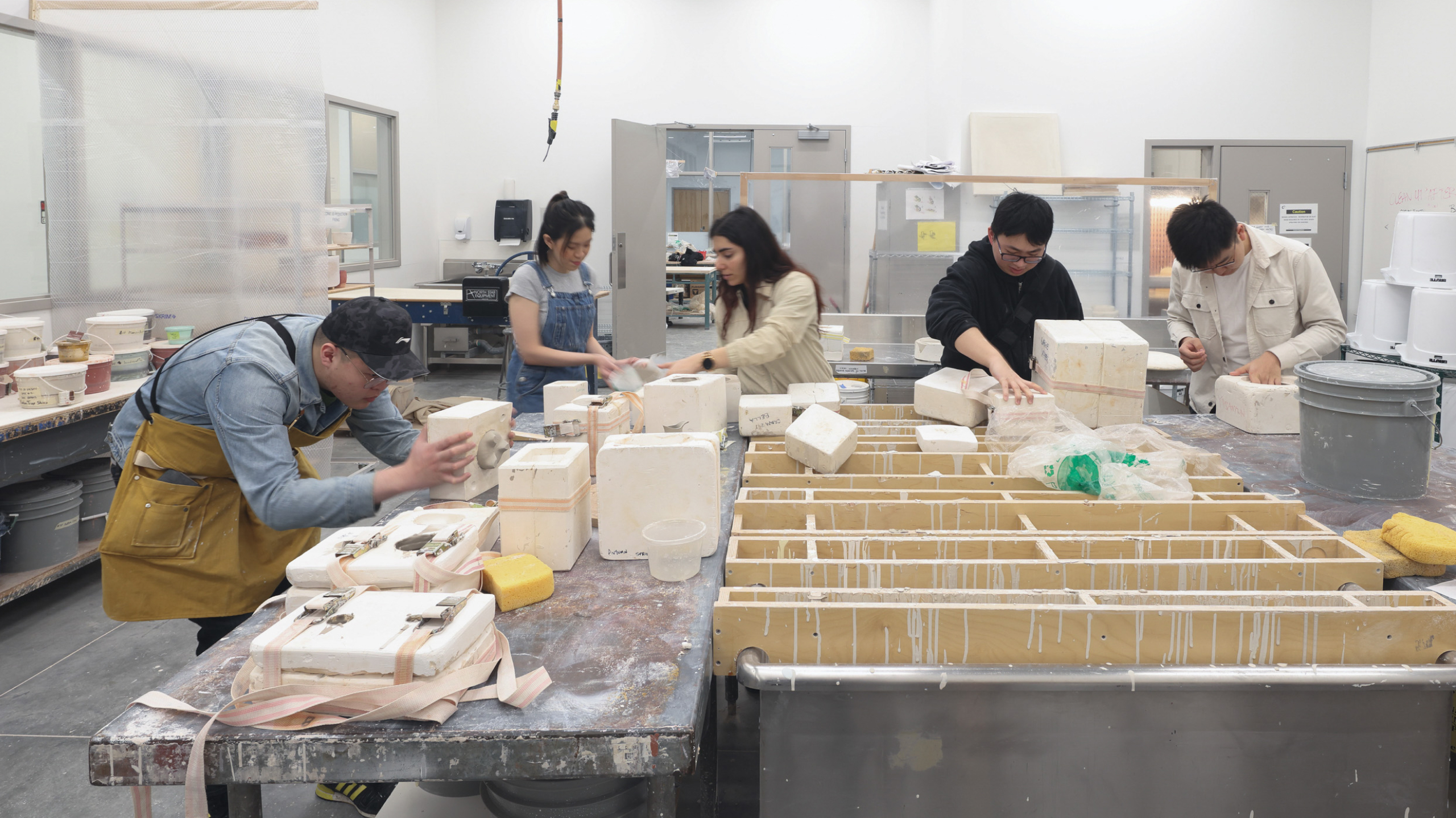 Students work on projects in ECU's ceramics studio.