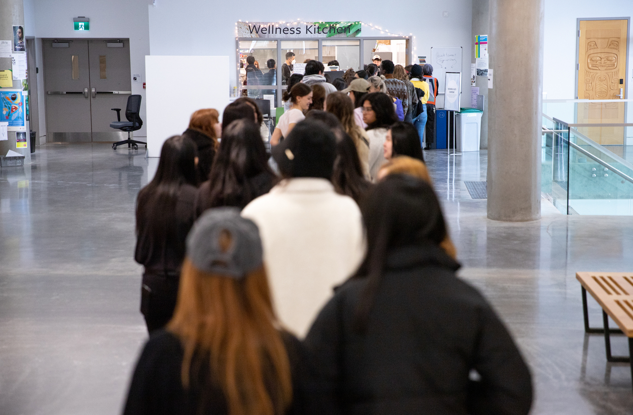 A line of students waiting for the Wellness Kitchen at ECU