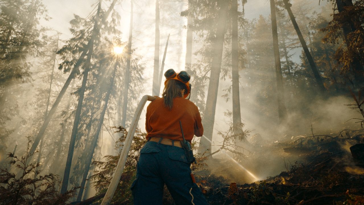 Wildfire Ep1 An Initial Attack crew member hoses down a fire in the Kootenays Photo courtesy CK9 Studios Optic Nerve Films